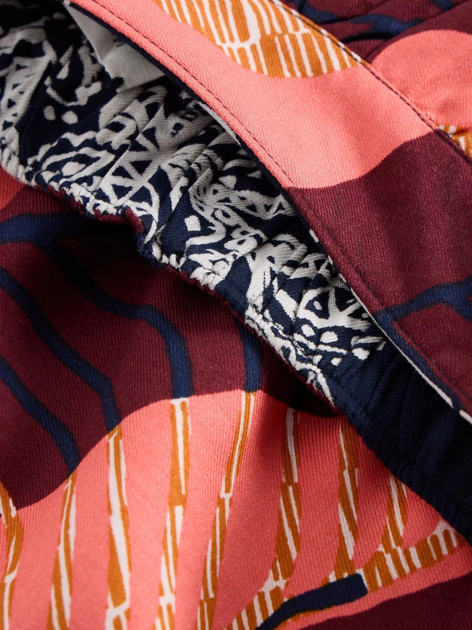 AVA Reversible Skirt in navy OR plum print by WhiteStuff